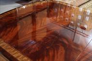 Flame mahogany dining table with inlay