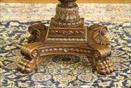 Antique reproduction empire center table with paw feet