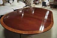 Custom round to oval table expands to 12 feet and seats up to 16