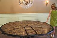 Expandable round dining table shown at 84 inches