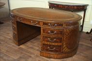 This leather top oval walnut partners desk is perfect for the high end home or office.