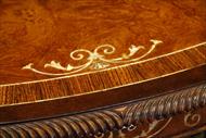 Mother of pearl inlay embellishes this luxurious 72 round walnut dining table 