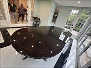 Round expanding walnut dining table