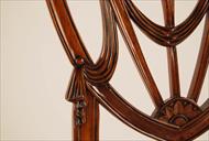 Mahogany shield back dining chairs, swag details