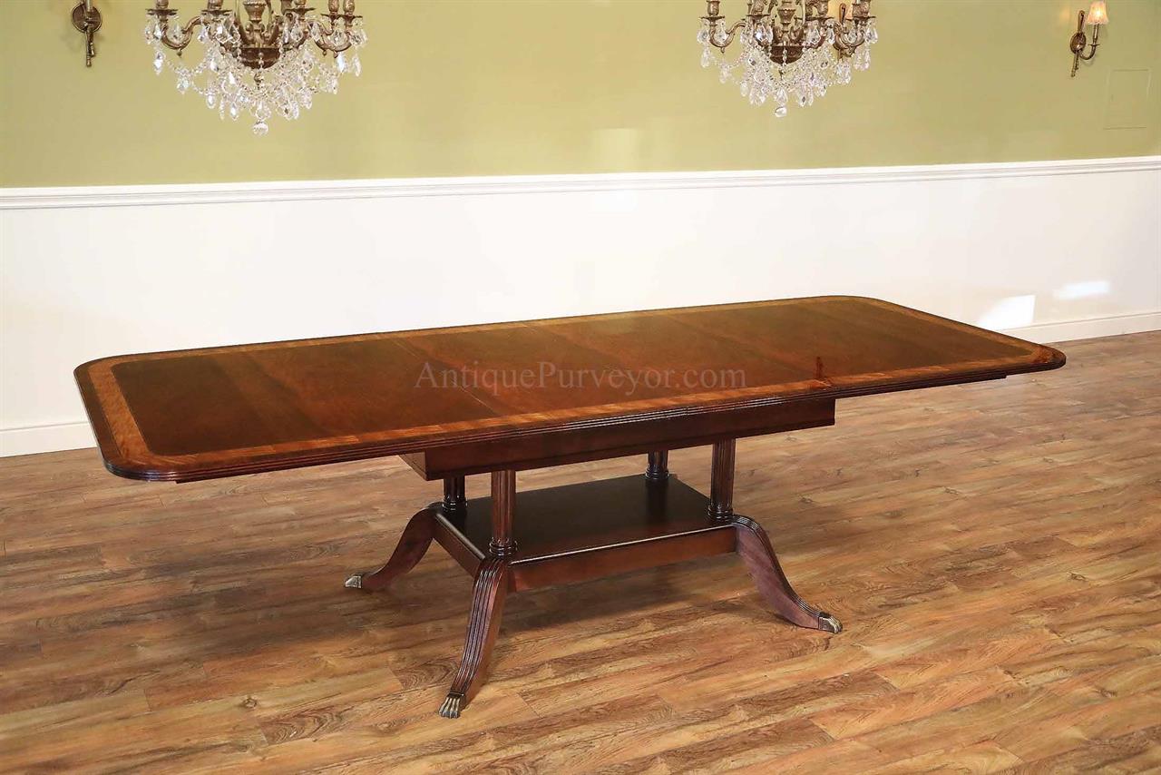 American made custom mahogany dining table with self storing leaves