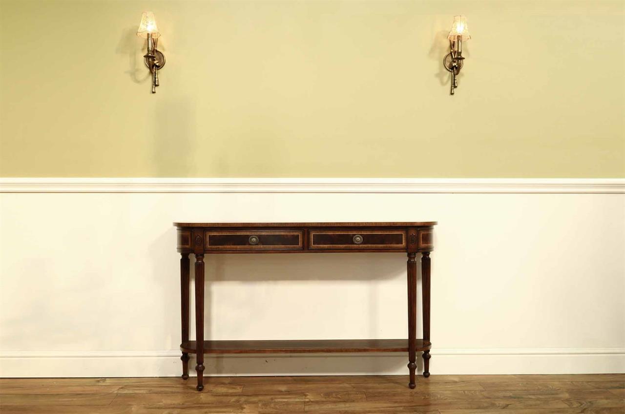 Banded mahogany console table with fluted legs and antiqued finish
