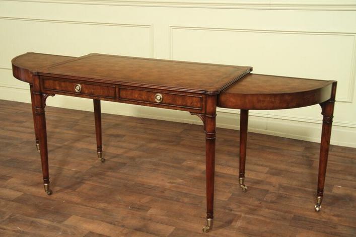 Expandable cerejeira writing desk with tapered legs and distressed finish.