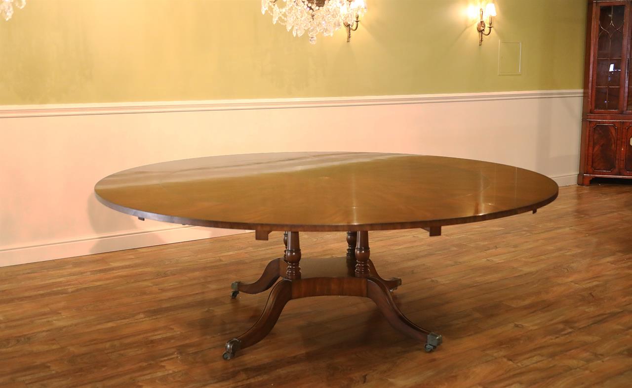 Round perimeter dining room table with star detail and matte sheen.