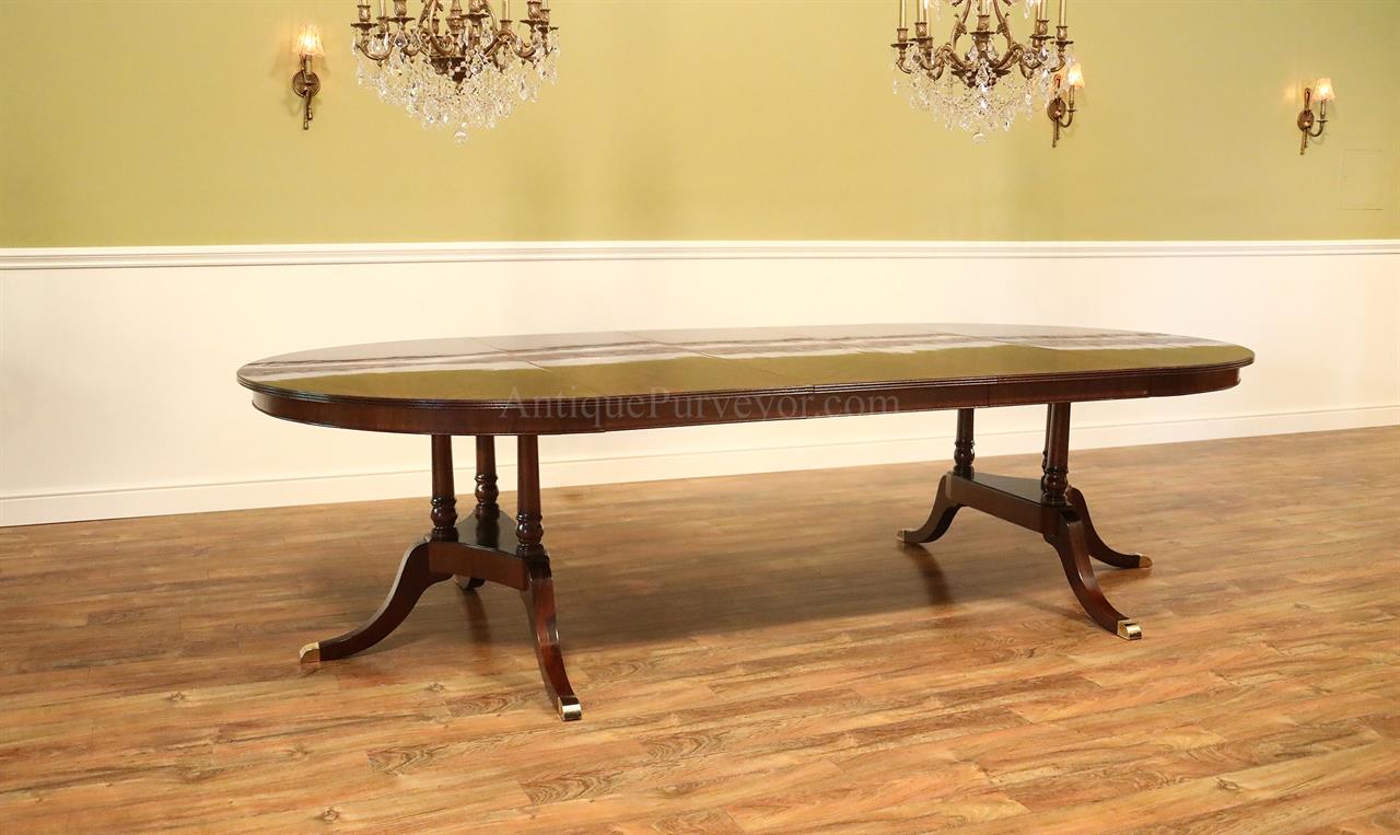 Heirloom mahogany round to oval dining table