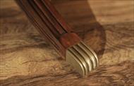 solid mahogany leg with brass capped feet