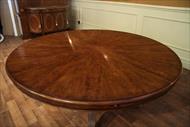 Large round walnut dining table