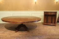 Expandable round walnut dining table