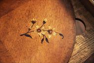 Inlaid flower on satinwood place mat