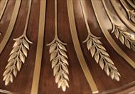 transitional round dining table with brass acanthus leaf mounts, details