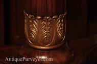 Gold accented collar at bottom of pedestal