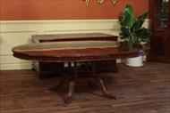 High end pie cut flame mahogany dining table, 60 round to 82 inch oval