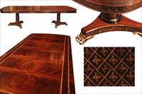 Chinoiserie decorated mahogany dining table with brass lion paw feet