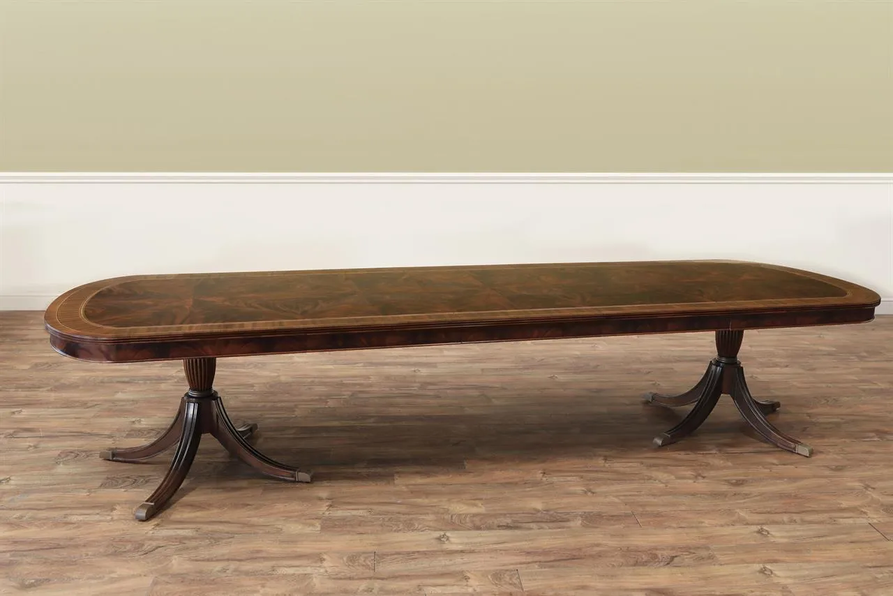 12-foot Inlaid Duncan Phyfe mahogany dining table with flame mahogany apron, and brass turned pedestals an AP Exclusive by AntiquePurveyor