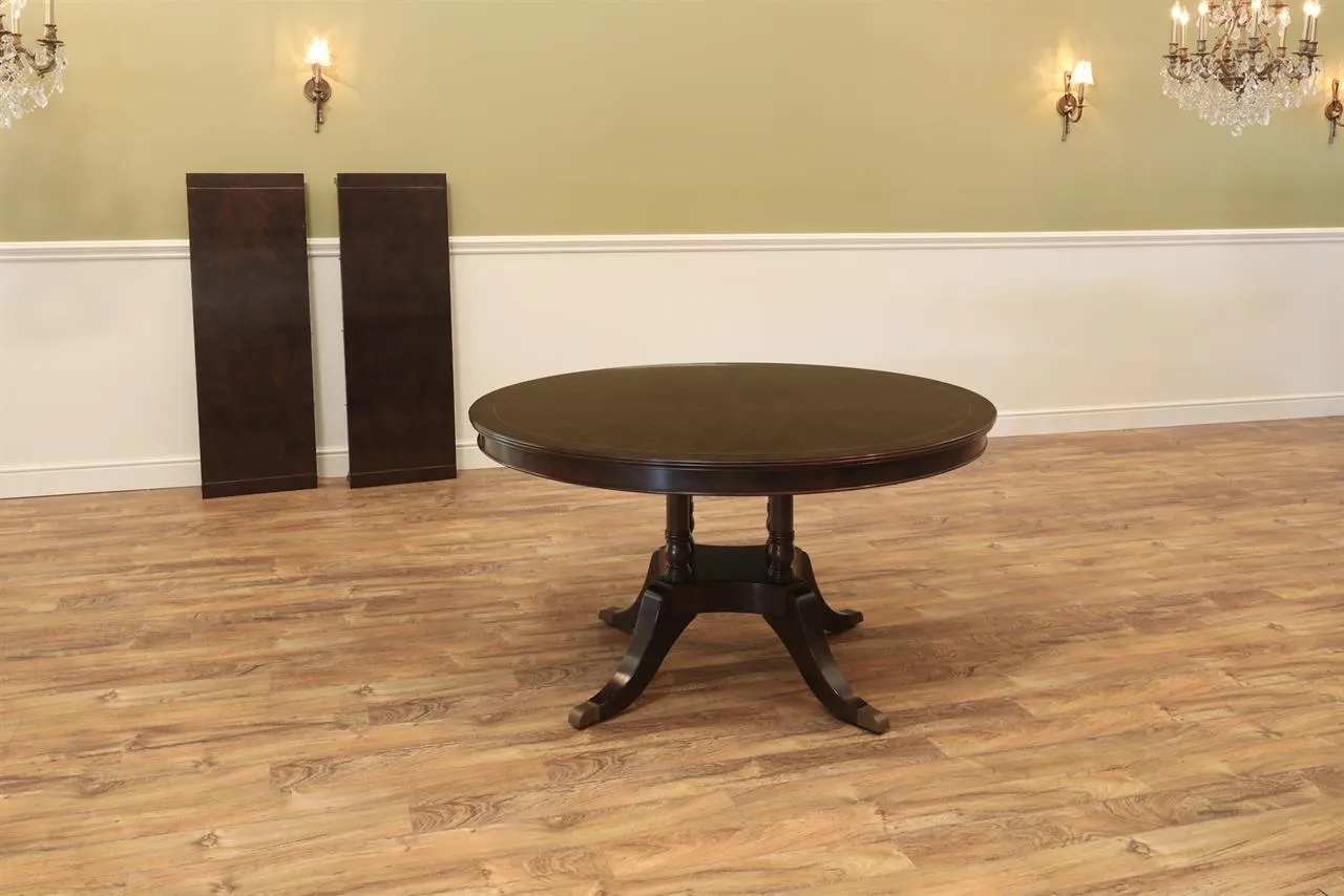 54 inch round to 90 inch oval mahogany dining table, with two leaves seats 4 to 8 people. Dark wood finish an AP Exclusive by AntiquePurveyor