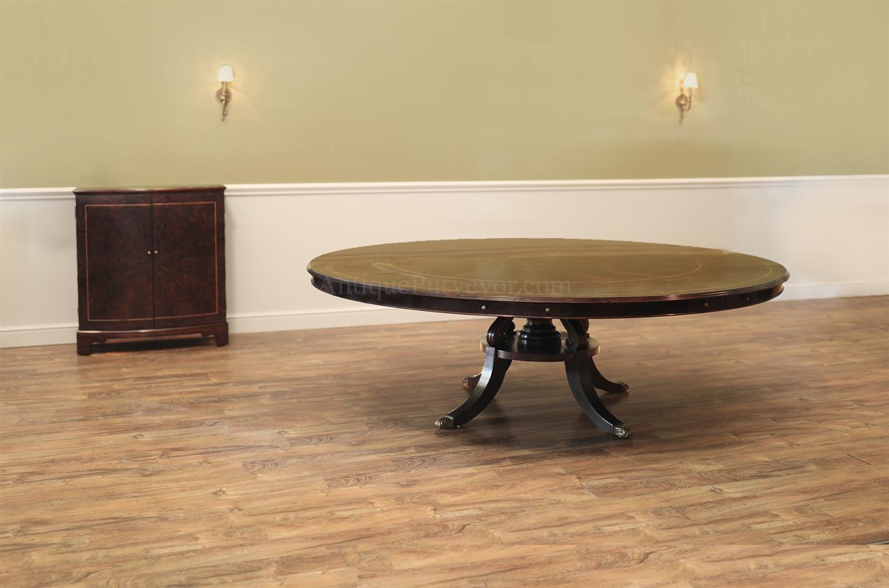Large round expandable mahogany dining table with matching leaf storage cabinet in our extra dark finish. an AP Exclusive by AntiquePurveyor