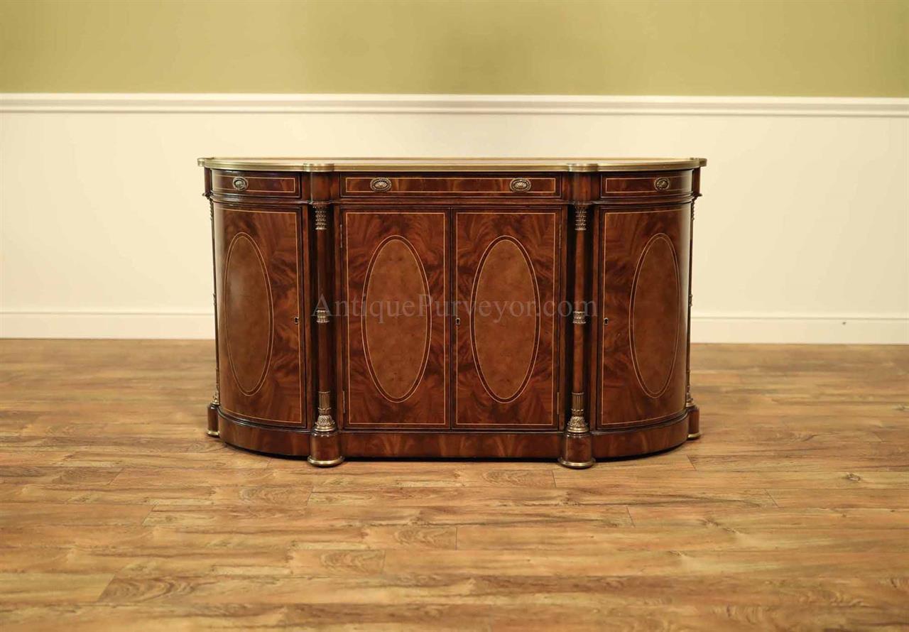 Bowfront sideboard. mahogany, walnut and brass mounted side cabinet. Antique reproduction, Empire original.