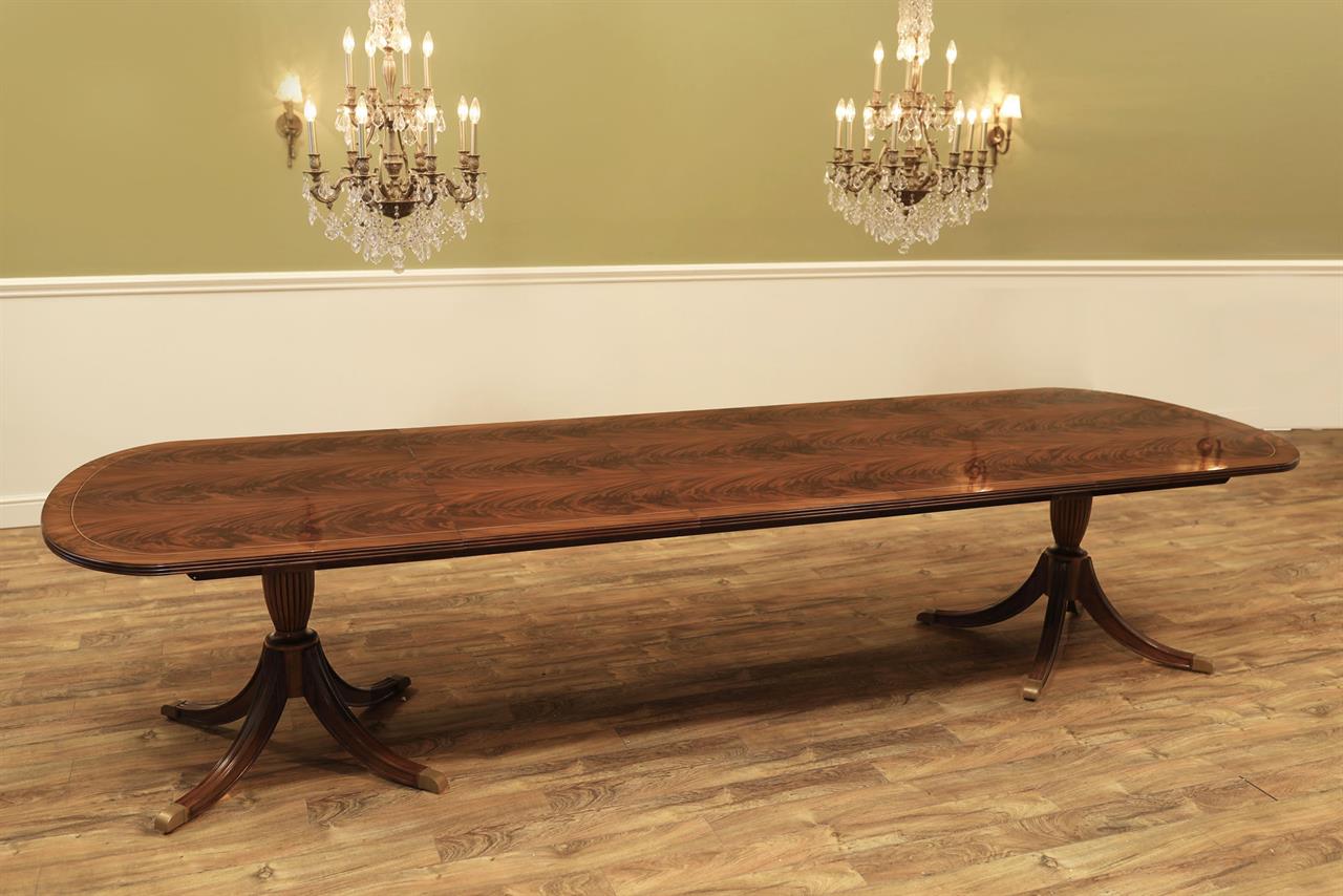 12 foot double pedestal dining table seats 14 people. Long-grain dining table with a minimalistic recessed apron. an AP Exclusive by AntiquePurveyor