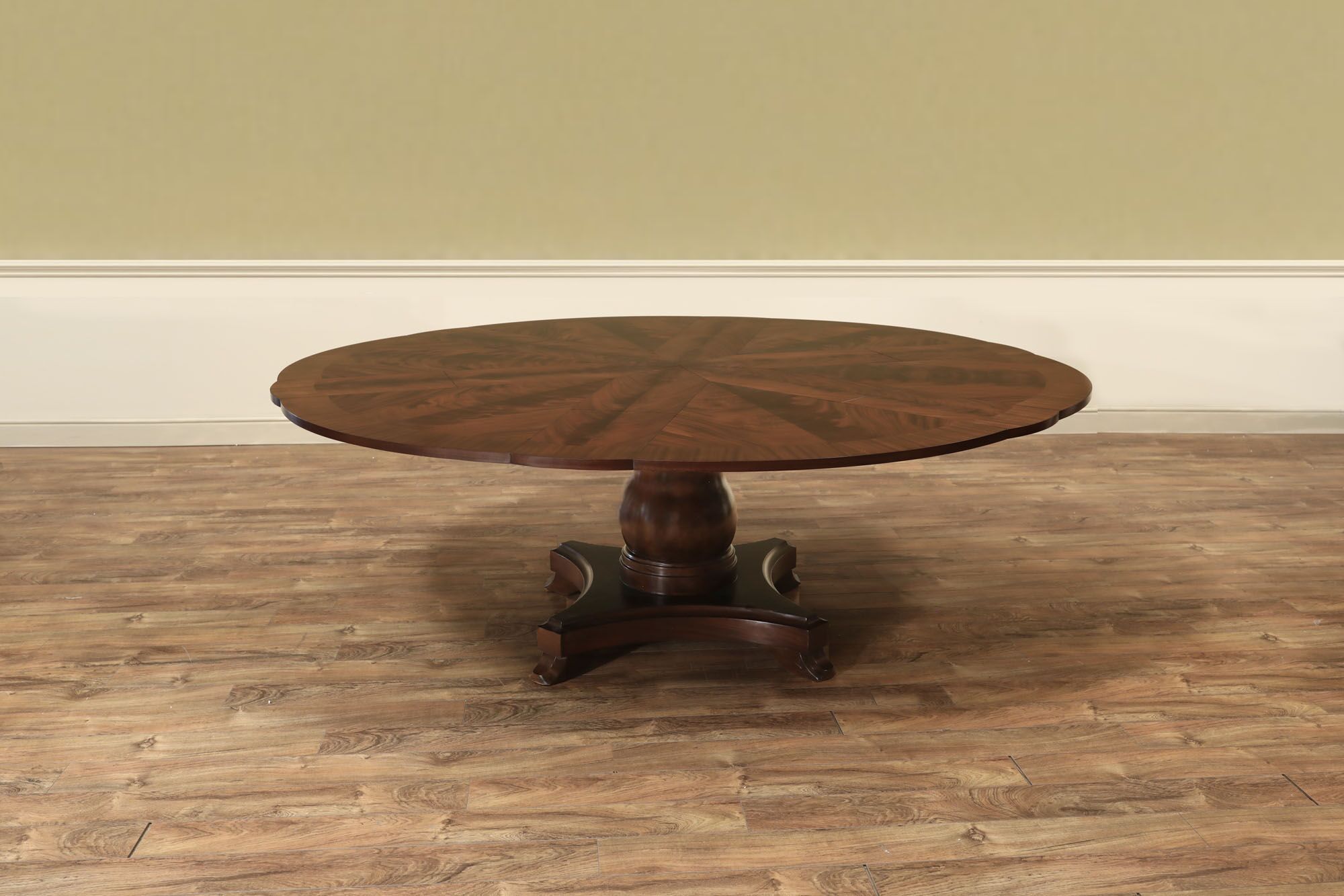 Mahogany Jupe table.  64 inch round to round solid dining table with brown mahogany finish. an AP Exclusive by AntiquePurveyor
