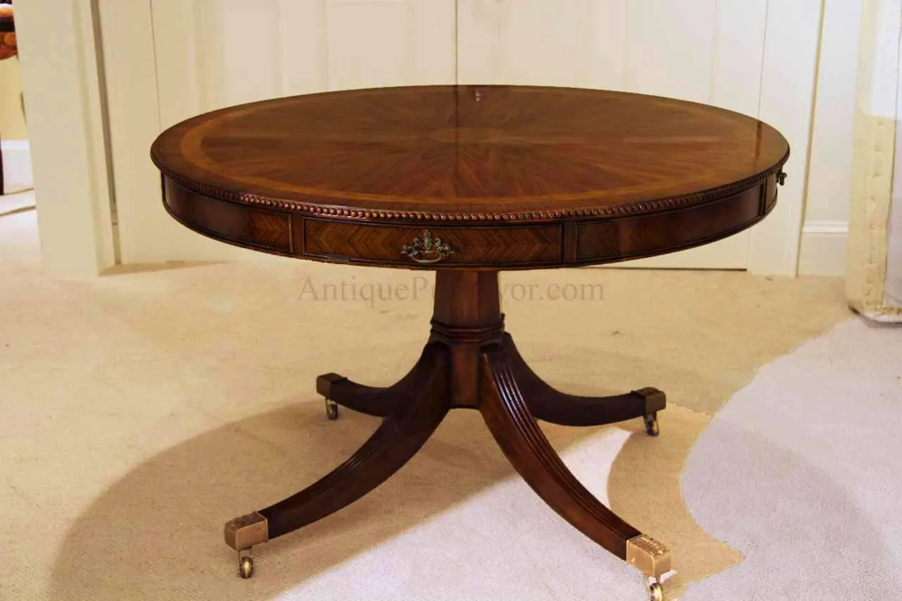 Formal rosewood and mahogany dining or center table with drawers. Finely carved beaded edge.