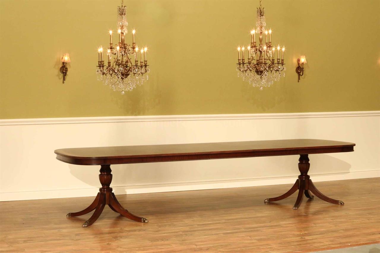 Large dining table seats 12 to 14. Fine high end mahogany dining table fitted with an apron or table skirt
