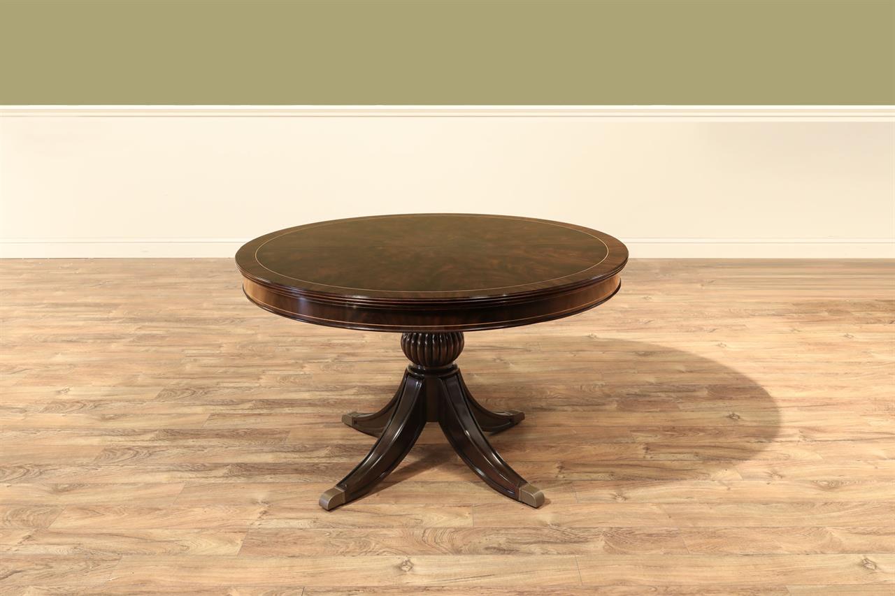 Round to Oval Dining Table in Dark Walnut Finish, With Self-Storing Leaf. Part of the Ap Exclusives Collection an AP Exclusive by AntiquePurveyor