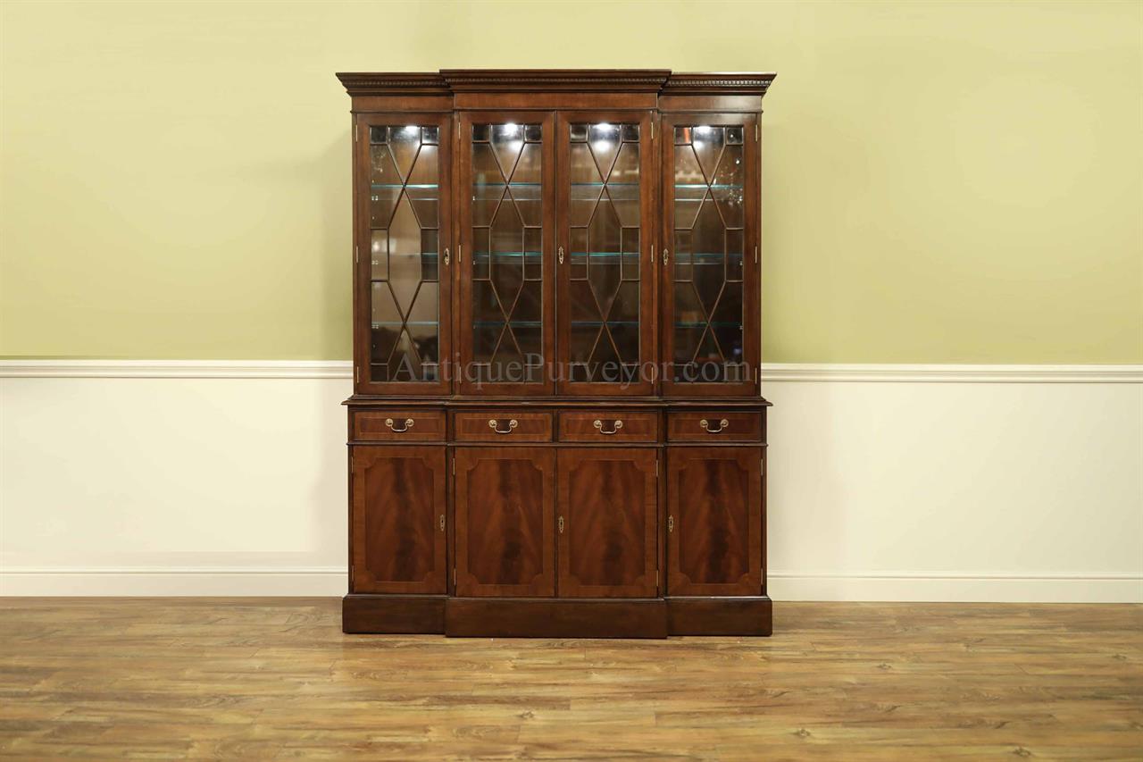 4 door high end china cabinet. Straight molded crown, mahogany banded door panels