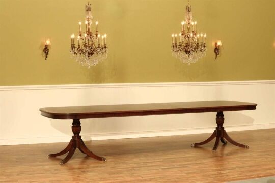 Large dining table seats 12 to 14. Fine high end mahogany dining table fitted with an apron or table skirt