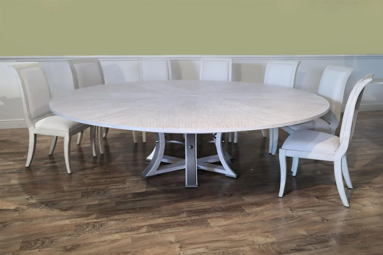 Large Round Expanding Jupe table for seating 8 to 12 people, white pigmented oak finish