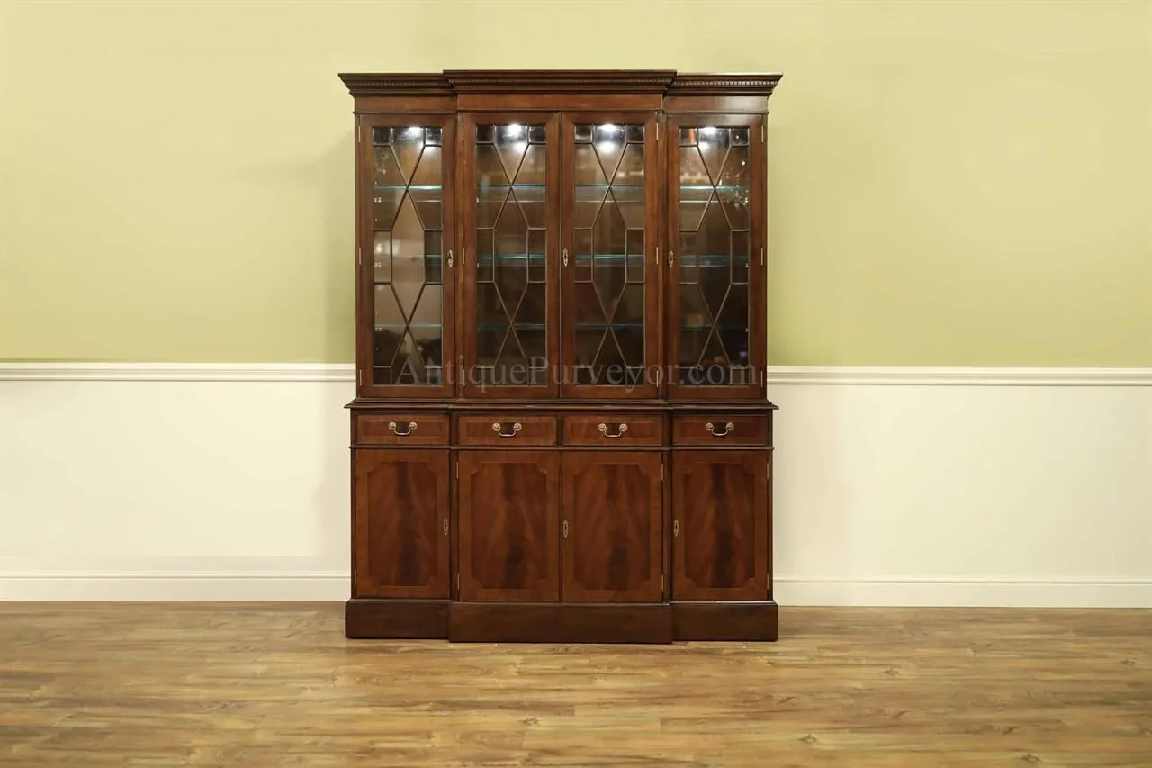 4 door high end china cabinet. Straight molded crown, mahogany banded door panels  Factory installed light kit on touch dimmer.