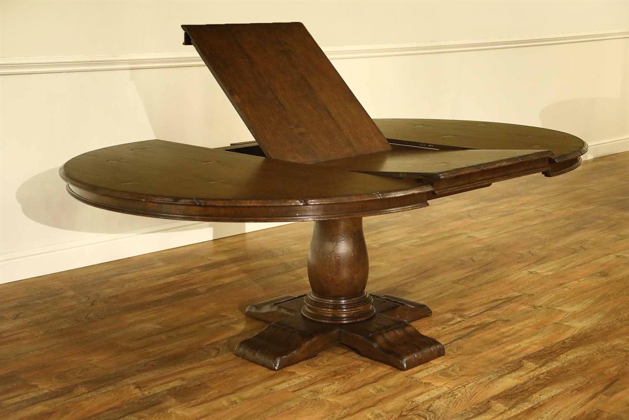 antique reproduction mission oak pedestal table with self storing leaf