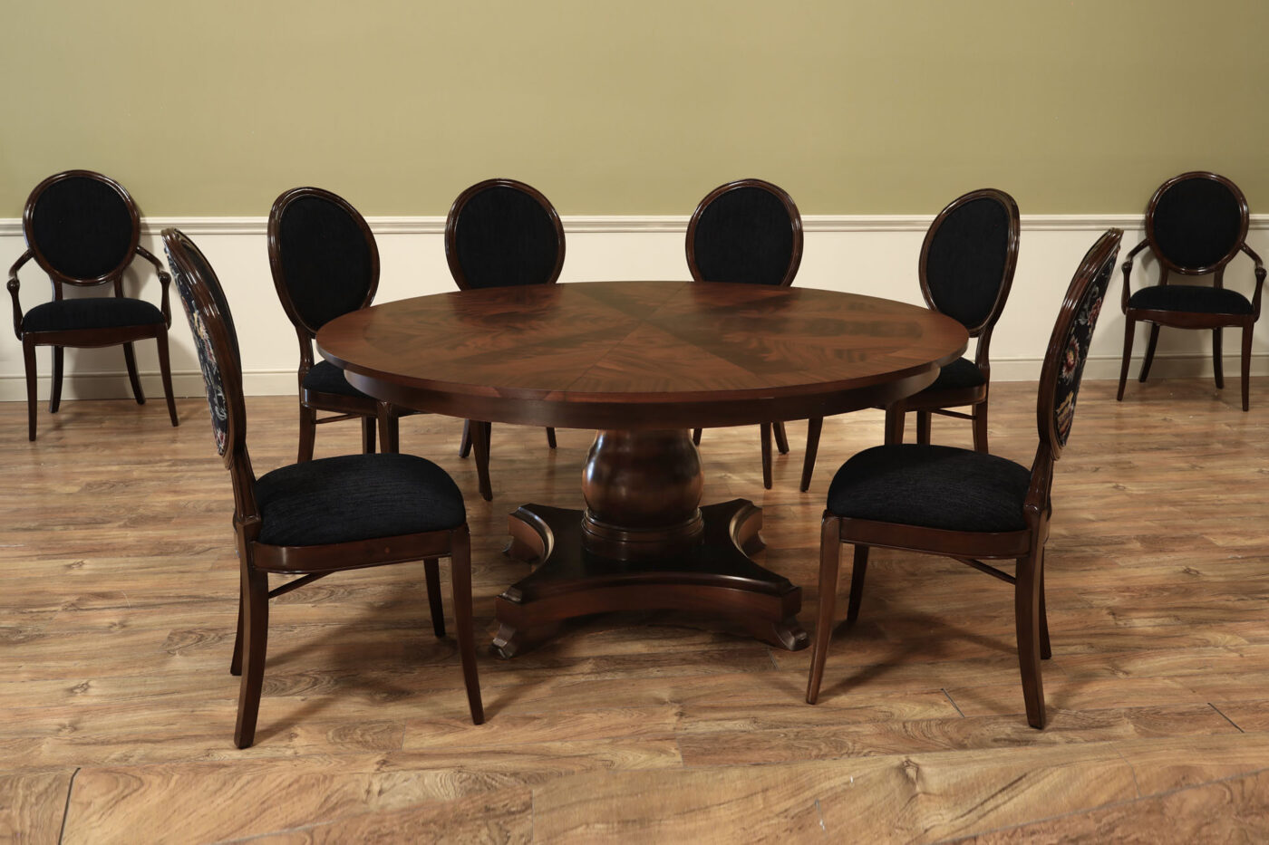 Mahogany Jupe table.  64 inch round to round solid dining table with brown mahogany finish. Leaves are self storing and fold out to make a larger 84 inch round dining table. - Image 6
