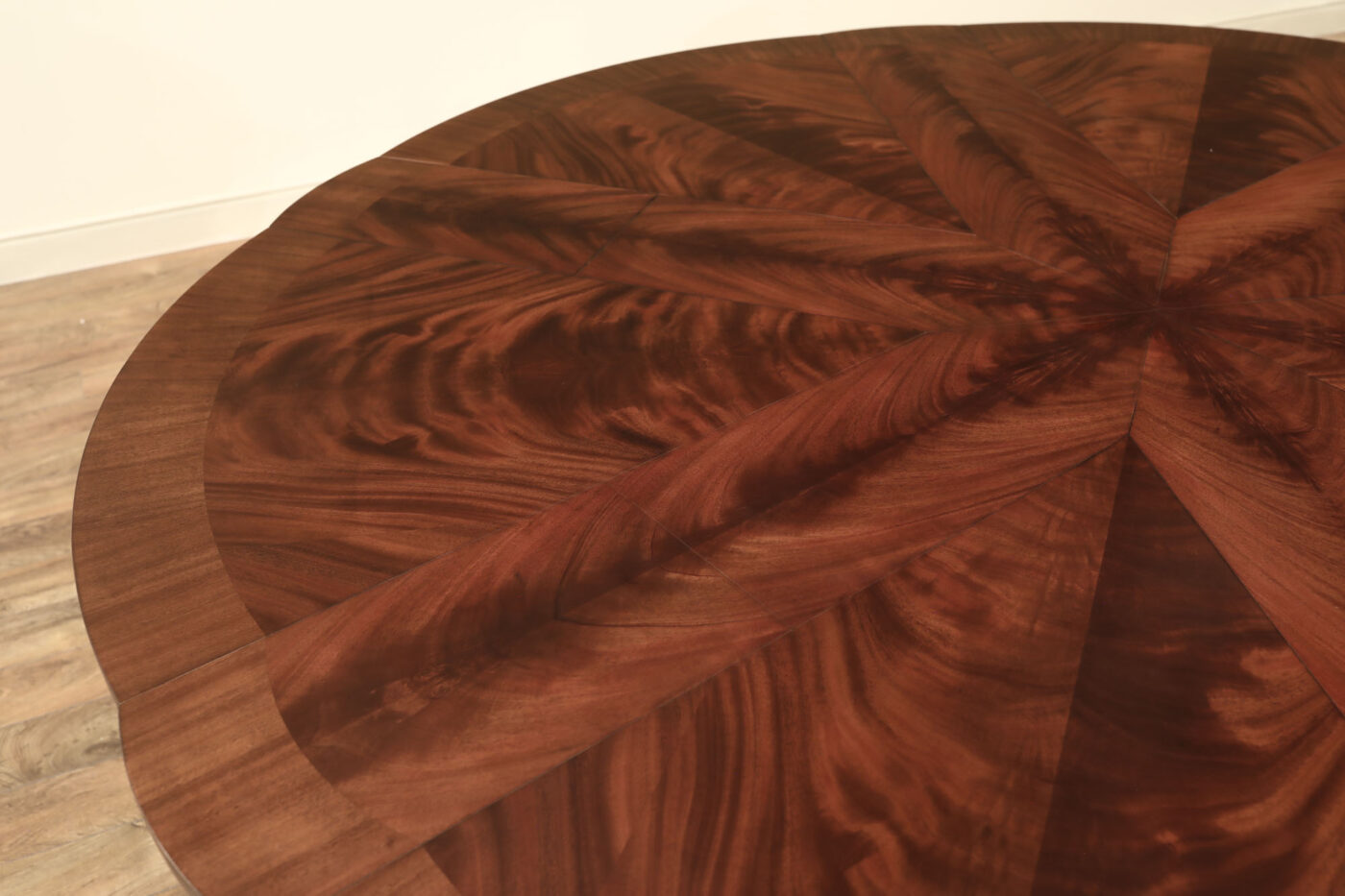 Mahogany Jupe table.  64 inch round to round solid dining table with brown mahogany finish. Leaves are self storing and fold out to make a larger 84 inch round dining table. - Image 11