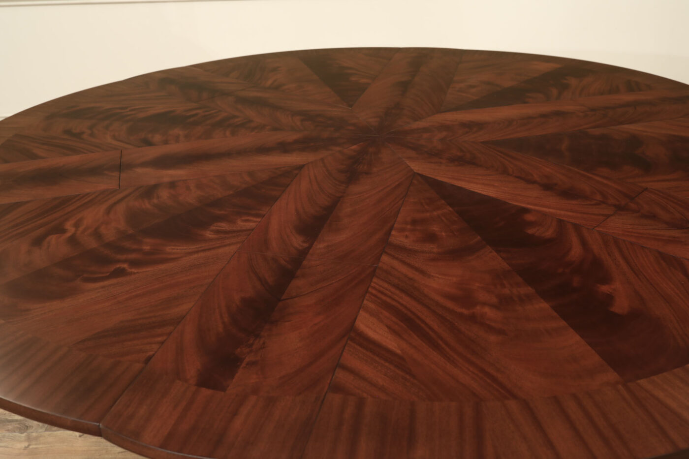 Mahogany Jupe table.  64 inch round to round solid dining table with brown mahogany finish. Leaves are self storing and fold out to make a larger 84 inch round dining table. - Image 7