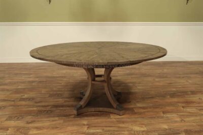 Transitional 48-64 inch round to round expanding oak jupe table. Expandable round dining table with self storing leaves seats 4 to 7 people.