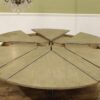 Modern or transitional Jupe table.  82 to 100 inch round to round expanding dining table with self-storing leaves seats 12 - Image 12