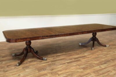 144 inch flame mahogany dining table with two 24" self storing leaves
