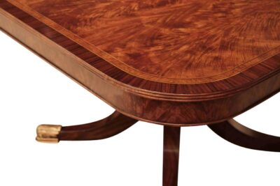 144 inch flame mahogany dining table with two 24" self storing leaves