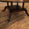 Duncan Phyfe pedestal with outswept saber legs and brass colored capped feet