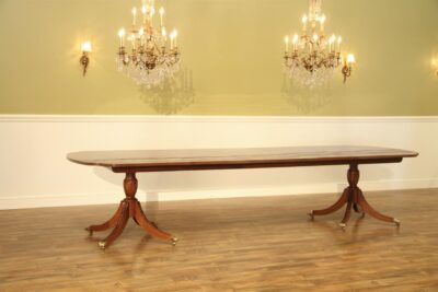 American made mahogany dining table opens to 140 inches and seats 14 people. New heirloom quality mahogany dining table with custom finish
