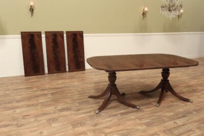 Duncan Phyfe double pedestal scallop corner dining room table seats 12 people.