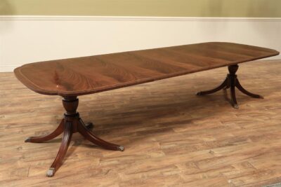 Duncan Phyfe double pedestal scallop corner dining room table seats 12 people.