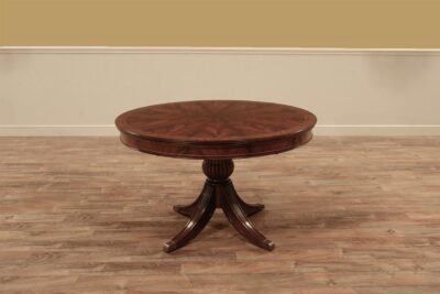 Exclusive 48" round to oval mahogany breakfast table with self-storing leaf. an AP Exclusive by AntiquePurveyor