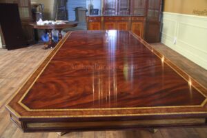 Extra large and wide mahogany dining table with self storing leaves and extra sturdy platform base.