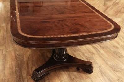 Flame mahogany wood dining table. Extending table with 3 24" leaves that seats 14-16.