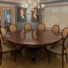 Round mahogany dining table shown in a northern New Jersey estate